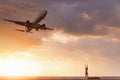 Travel Destination and Vacation in Summer, Sexy Woman Having Fun While Capturing Photos Airplane is Flying Over The Beach. Tourist