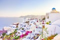 Travel Destinations. People Preparing for Sunset at Caldera Volcanic Slope of Oia Village in Santorini Island in Greece Royalty Free Stock Photo