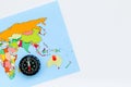 Travel direction and trip planning concept with compass and map of the world on white background top view mock up Royalty Free Stock Photo