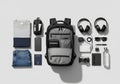 Travel essentials arranged neatly include a gray and black Royalty Free Stock Photo