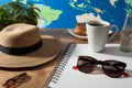 Travel essentials and a coffee cup, embodying the spirit of holiday tourism