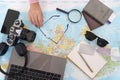 Travel Essentials. Overhead view of travel items on a map. Royalty Free Stock Photo