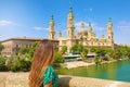 Travel in Europe. Back view beautiful woman looking at Zaragoza Cathedral Basilica of Our Lady of the Pillar landmark, Zaragoza, Royalty Free Stock Photo