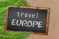 Travel Europe palm trees and blackboard on sandy beach Royalty Free Stock Photo