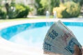 Travel Expenses Female Holds Turkish Lira Near By Pool at Summer Time Bozcaada Canakkale Turkey 2017