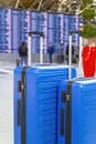 Travel Fashion. Closeup Shot Of Two Plastic Suitcases Standing At Airport , Stylish Luggage Bags Waiting At Terminal Royalty Free Stock Photo