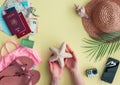 Travel flat lay with hands holding a seashell Royalty Free Stock Photo