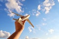 Travel and flight concept, airplane model in a man`s hand. Travel photography motivator for vacation Royalty Free Stock Photo