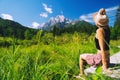 Travel, Freedom, Lifestyle concept. Young woman enjoying green nature outdoors. Amazing view on Zelenci into English means - Royalty Free Stock Photo