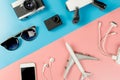 Travel Gadgets on blue and pink pastel Royalty Free Stock Photo