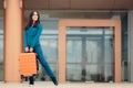 Happy Woman At Airport Station with Suitcase Royalty Free Stock Photo