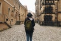 Travel girl with backpack walking in europe