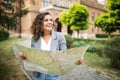 Travel guide, tourism in Europe, woman tourist with map on the street Royalty Free Stock Photo