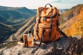 travel hiking backpack with a water bottle on a scenic mountain terrain trail background. Generative AI