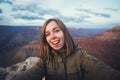 Travel hiking selfie photo of young beautiful teenager student at Grand Canyon viewpoint in Arizona Royalty Free Stock Photo