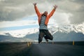 Travel hitchhiker man on a road