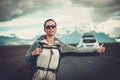 Travel hitchhiker woman walking on a road Royalty Free Stock Photo