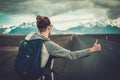 Travel hitchhiker woman walking on a road Royalty Free Stock Photo