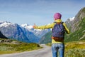 Travel hitchhiker woman walking on road during holiday travel Royalty Free Stock Photo