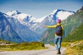 Travel hitchhiker woman walking on road during holiday travel Royalty Free Stock Photo