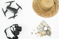 Travel holiday composition. Drone, hat, photo camera, retro compass and US cash on white. Flat lay Royalty Free Stock Photo