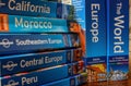 Travel and holiday image. A collection of travel guides sit on a table Royalty Free Stock Photo