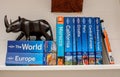 Travel and holiday image. A collection of travel guides sit on a table Royalty Free Stock Photo