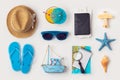 Travel holiday vacation concept with beach and travel items organized on white background Royalty Free Stock Photo