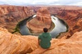 Travel in Horseshoe bend canyon, man Hiker enjoying view, Arizona, USA