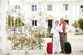 Travel, hotel and senior couple relax on vacation with suitcase in a holiday location happy in retirement together. Bag Royalty Free Stock Photo