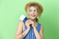 Travel Ideas. Dreaming Winsome Llovely Smiling Young Girl in Straw Hat And Blue Dress Holding Passport with Tickets Over Trendy