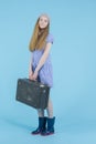 Travel Ideas. Full Length Portrait of Caucasian Teenage Girl In Long Blue Dress, Wellington Rubber Boots Posing With Travel Royalty Free Stock Photo