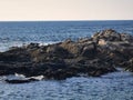 Travel - image. Beach beauty seen from the big rock. Stones balance on beach, sunrise shot. Sea Wave and rock; natural background Royalty Free Stock Photo