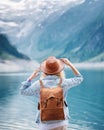 Travel image. Traveler look on the mountain lake. Travel and active life concept.