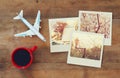 Travel instant photographs next to cup of coffee and airplane Royalty Free Stock Photo