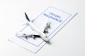 Travel insurance brochure with airplane model Royalty Free Stock Photo