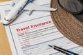 Travel Insurance Claim application form and hat with eyeglass an Royalty Free Stock Photo