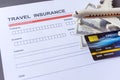 Travel  insurance form with model and policy document Royalty Free Stock Photo