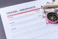 Travel  insurance form with model and policy document Royalty Free Stock Photo