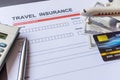 Travel  insurance form with model and policy document Royalty Free Stock Photo