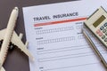 Travel  insurance form with model and policy document Royalty Free Stock Photo