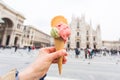 Travel, Italy and holidays concept - Ice cream in front of Milan Cathedral Duomo