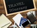 Travel itinerary handwritten with white chalk on a blackboard decorate with plane model, passport, money wallet , notebook