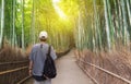 Travel in Japan, a man with backpack travelling at Arashiyama bamboo forest, famous travel destination in Kyoto Japan Royalty Free Stock Photo