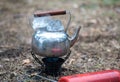 Travel kettle with ice on the primus fire.