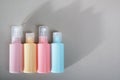 Travel kit. Set of four plastic bottles for cosmetic products. Royalty Free Stock Photo