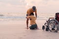 Travel and learning, Disabled child at the beach, Caring from family. Royalty Free Stock Photo