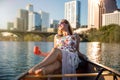 Travel and leisure commercial model, woman on canoe boat kayak relaxing enjoying summer fun day on river in Austin downtown