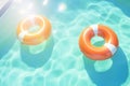 Round inflatables rubber swimming rings in pool. Generative AI Royalty Free Stock Photo