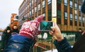 Travel lifestyle. woman taking pictures friends treet Stockholm winter